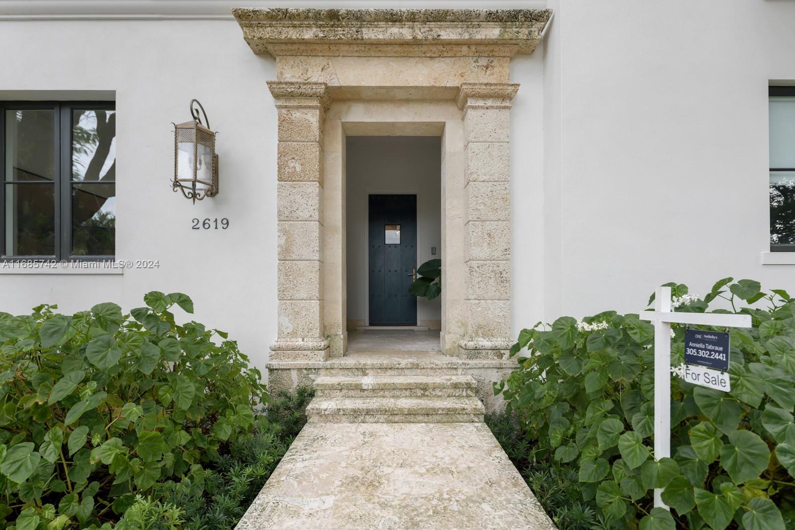 2619 Anderson Road Coral Gables, FL 33134 - Photo 62 of 63 a front view of a house with garden