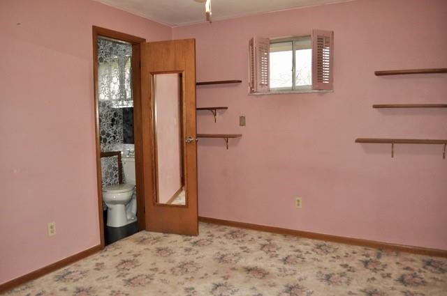 305 Parkhill Road Baden, PA 15005 - Photo 12 of 15 a view of an empty room with closet and wooden floor