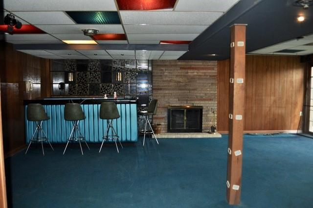 305 Parkhill Road Baden, PA 15005 - Photo 15 of 15 a dining room with furniture and a fireplace