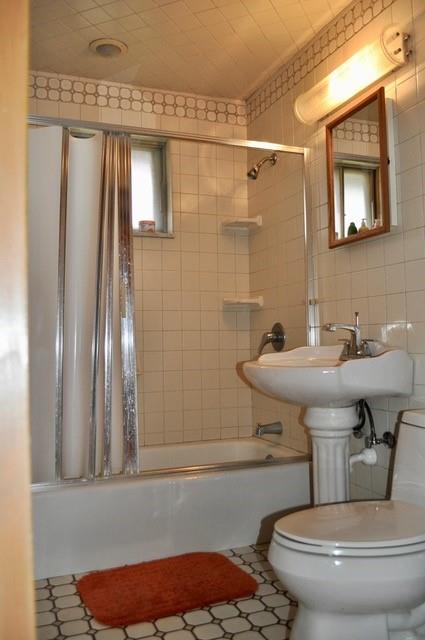 305 Parkhill Road Baden, PA 15005 - Photo 9 of 15 a bathroom with a sink a toilet and shower