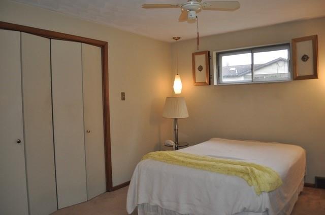 305 Parkhill Road Baden, PA 15005 - Photo 10 of 15 a bedroom with a bed and a chandelier