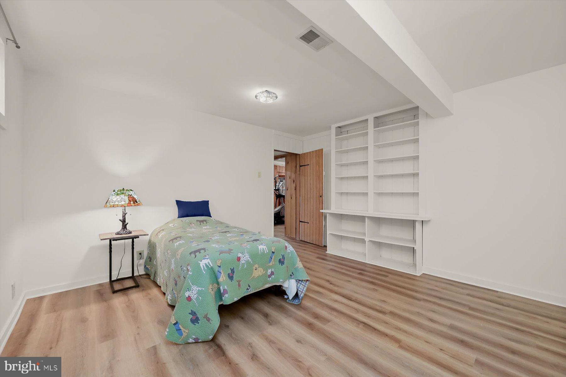 7605 Stewart Hill Road Adamstown, MD 21710 - Photo 133 of 139 4th bedroom w/ built in shelving; new LVP flooring