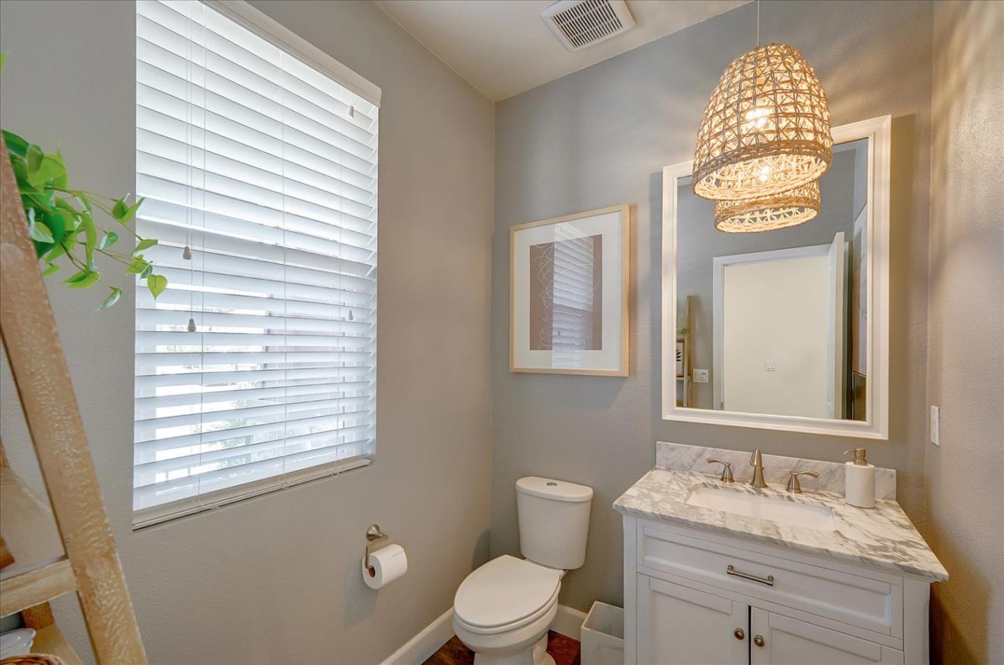 2580 Apple Tree Way Gilroy, CA 95020 - Photo 29 of 45 a bathroom with a toilet sink and mirror