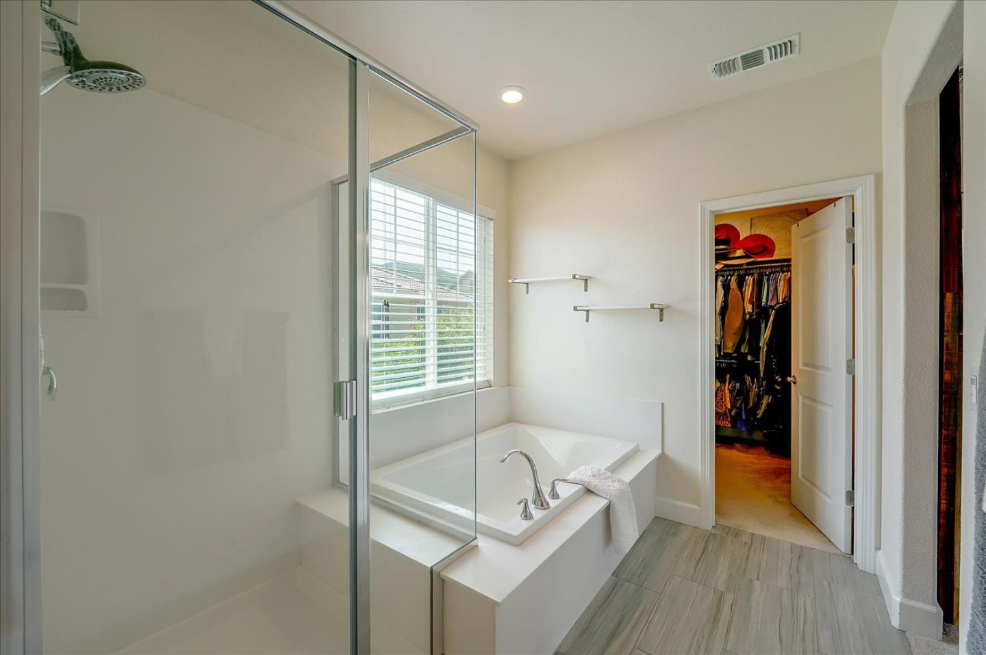 2580 Apple Tree Way Gilroy, CA 95020 - Photo 35 of 45 a bathroom with a tub and a shower