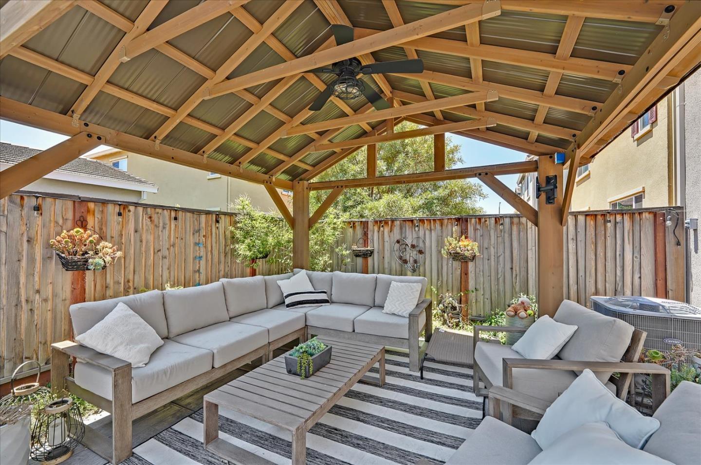 2580 Apple Tree Way Gilroy, CA 95020 - Photo 41 of 45 a view of a patio with couches and chairs with wooden floor