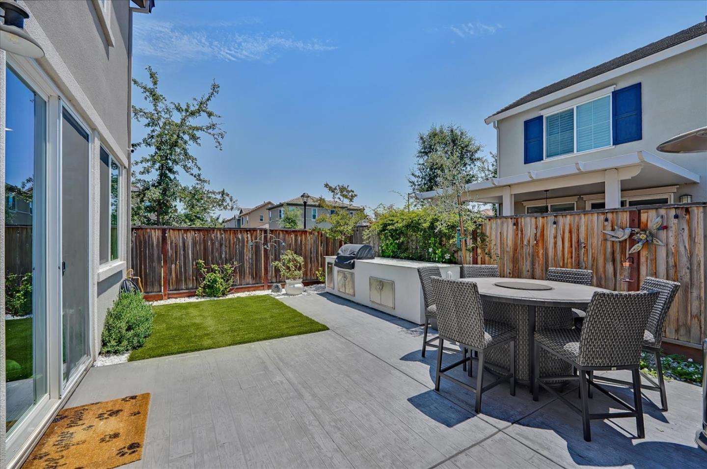 2580 Apple Tree Way Gilroy, CA 95020 - Photo 42 of 45 a view of a patio with table and chairs and potted plants