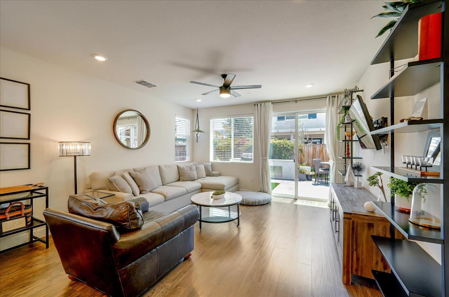 2580 Apple Tree Way Gilroy, CA 95020 - Photo 7 of 45 a living room with furniture a fireplace and a large window