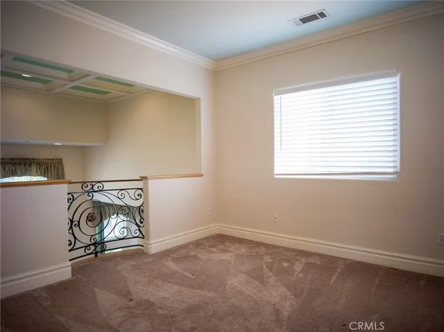 a view of an empty room with windows