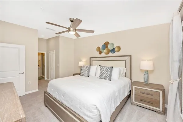 a bathroom with a sink vanity mirror and toilet