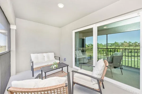 a view of a room with gym equipment and a large window