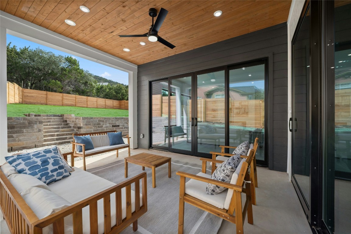11205 Beach Road Leander, TX 78641 - Photo 12 of 31 a living room with furniture and a floor to ceiling window