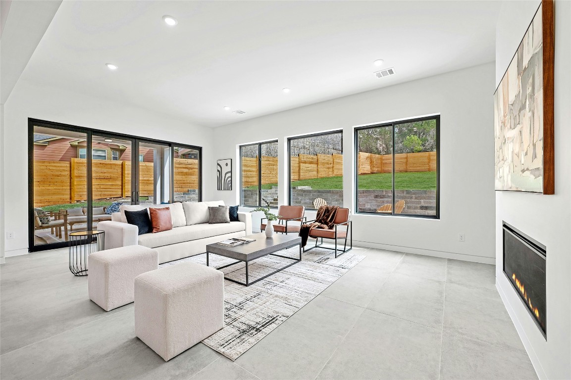11205 Beach Road Leander, TX 78641 - Photo 15 of 31 a living room with furniture and large windows