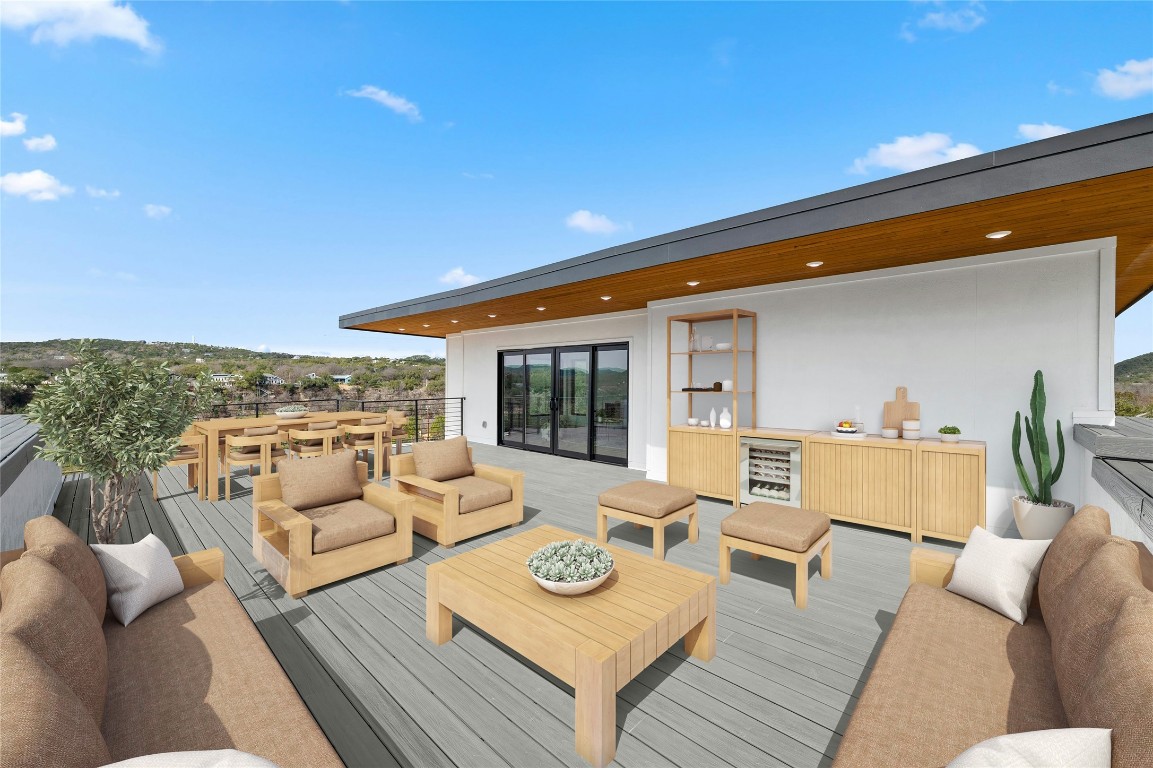 11205 Beach Road Leander, TX 78641 - Photo 28 of 31 a view of a patio with couches and table and chairs with wooden floor and fence