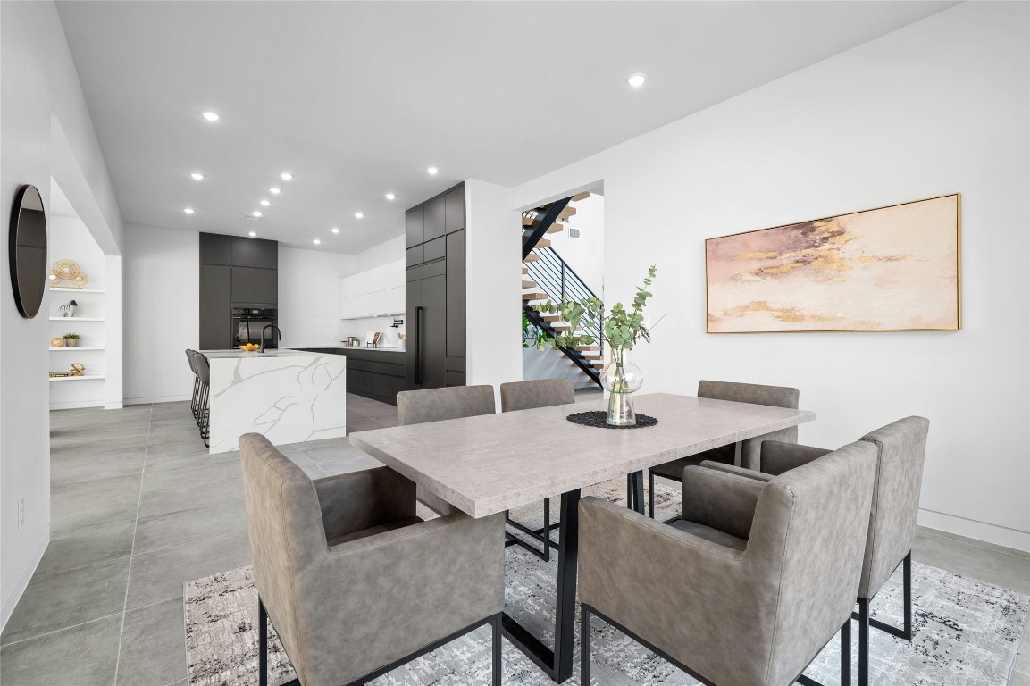 11205 Beach Road Leander, TX 78641 - Photo 10 of 31 a view of a dining room with furniture and a potted plant