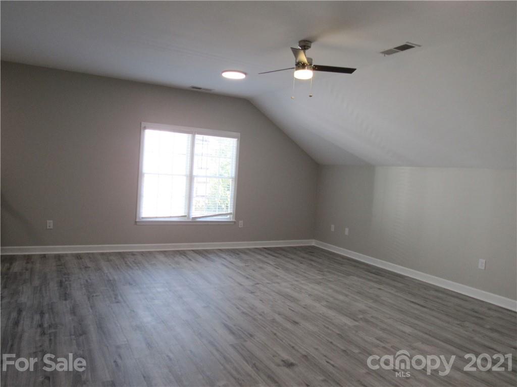112 Comata Road Mooresville, NC 28117 - Photo 12 of 14 wooden floor in an empty room with a window