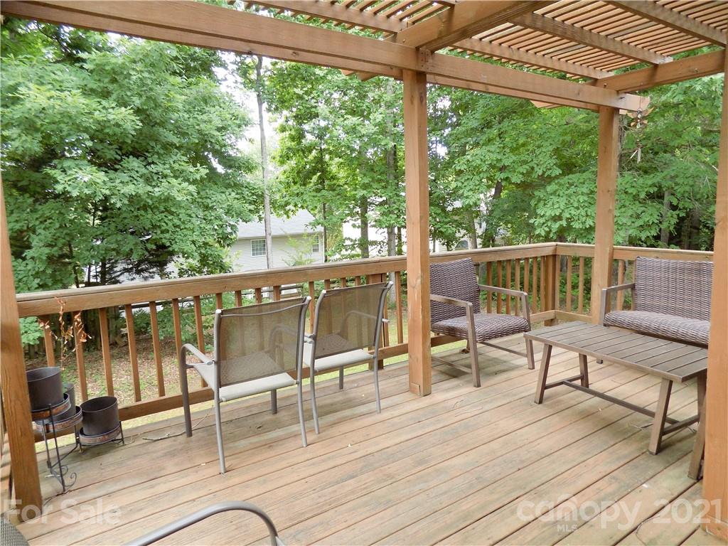 112 Comata Road Mooresville, NC 28117 - Photo 13 of 14 a view of a chairs and table on the wooden deck