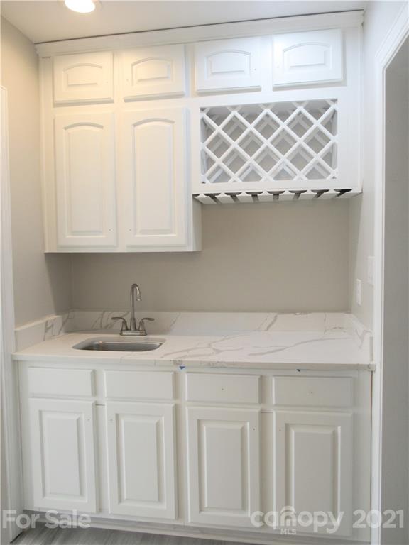 112 Comata Road Mooresville, NC 28117 - Photo 5 of 14 a kitchen with a sink and cabinets