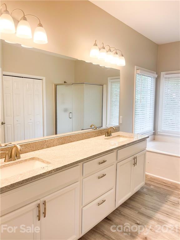 112 Comata Road Mooresville, NC 28117 - Photo 8 of 14 a bathroom with a sink and a large mirror