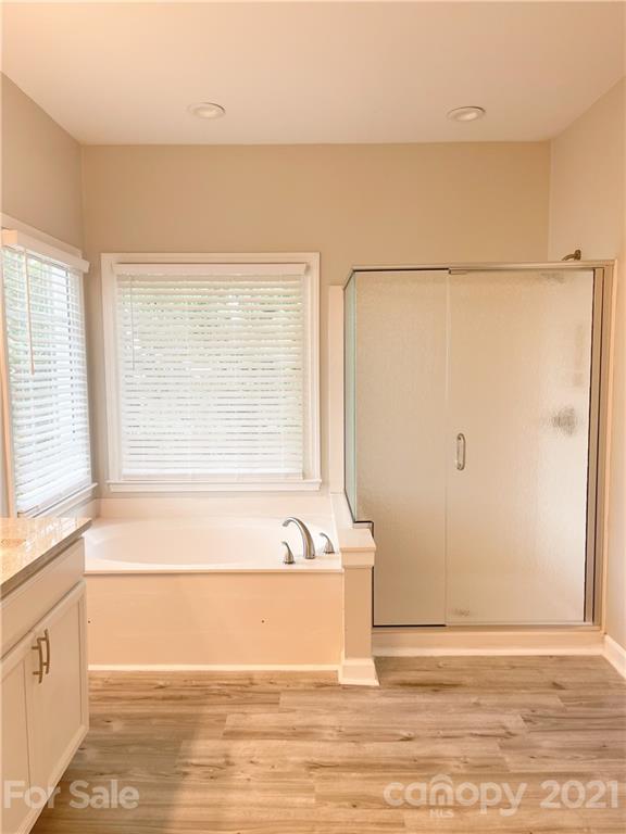 112 Comata Road Mooresville, NC 28117 - Photo 9 of 14 a view of a bathtub in a room