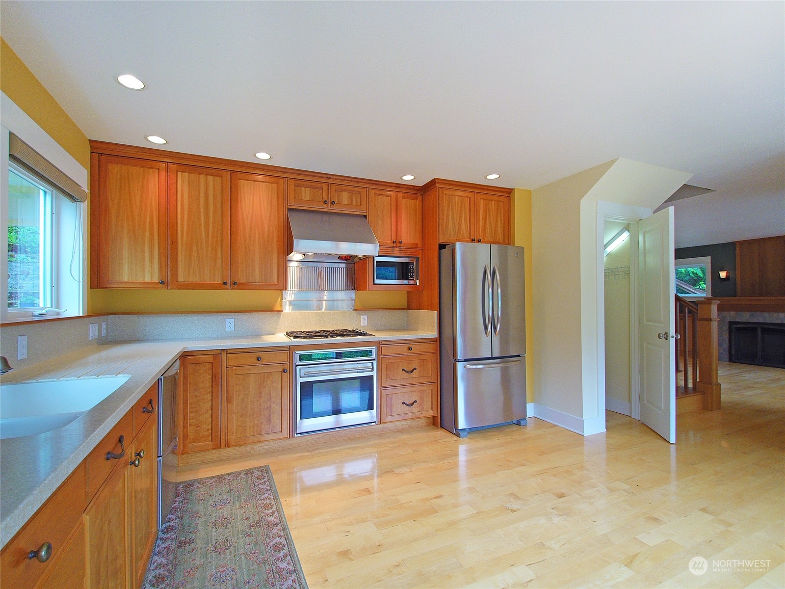 308 Lake Sutherland Road Port Angeles, WA 98363 - Photo 11 of 40 a kitchen with stainless steel appliances granite countertop a refrigerator sink and stove