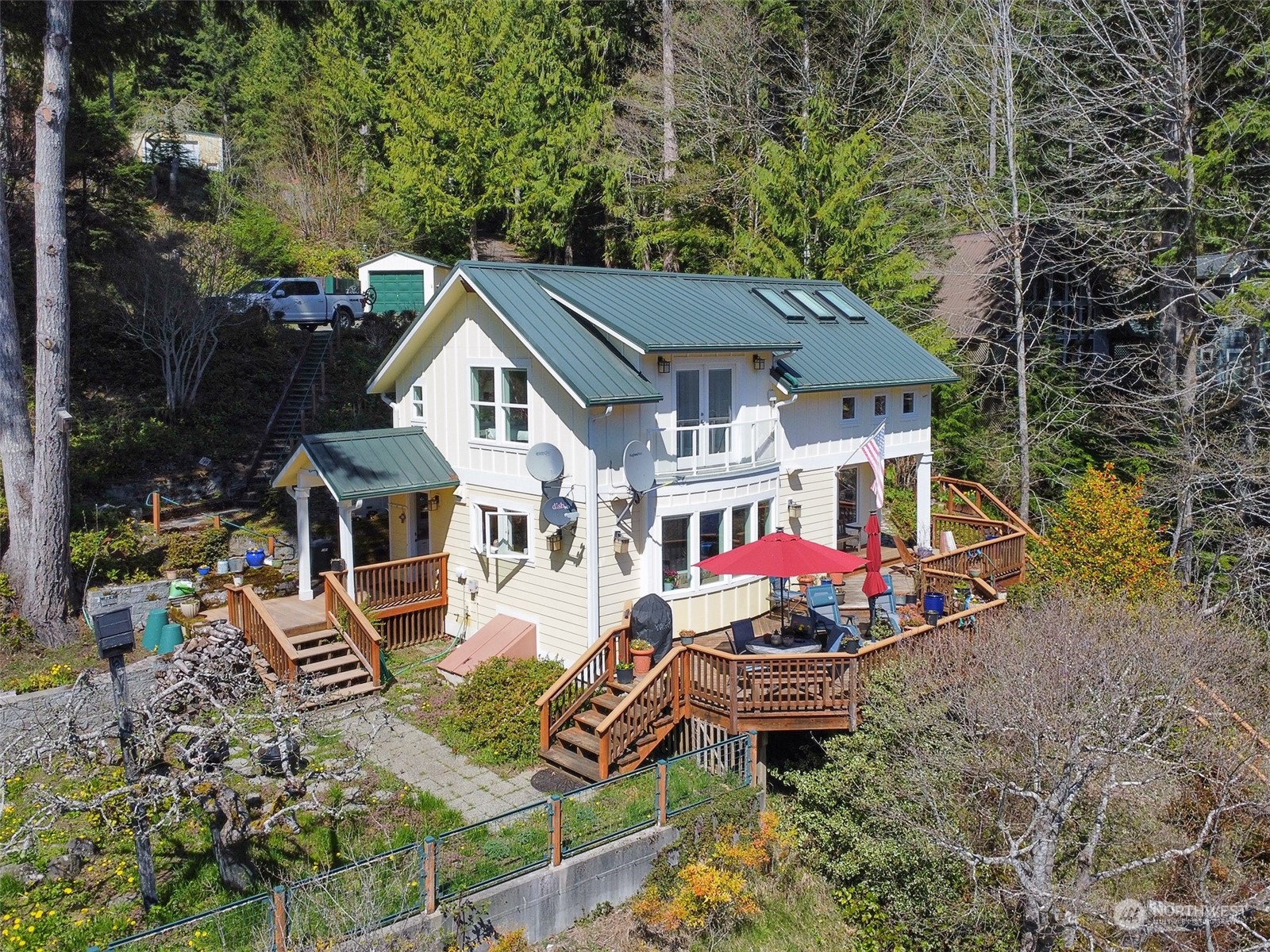 308 Lake Sutherland Road Port Angeles, WA 98363 - Photo 2 of 40 an aerial view of a house with yard porch and furniture