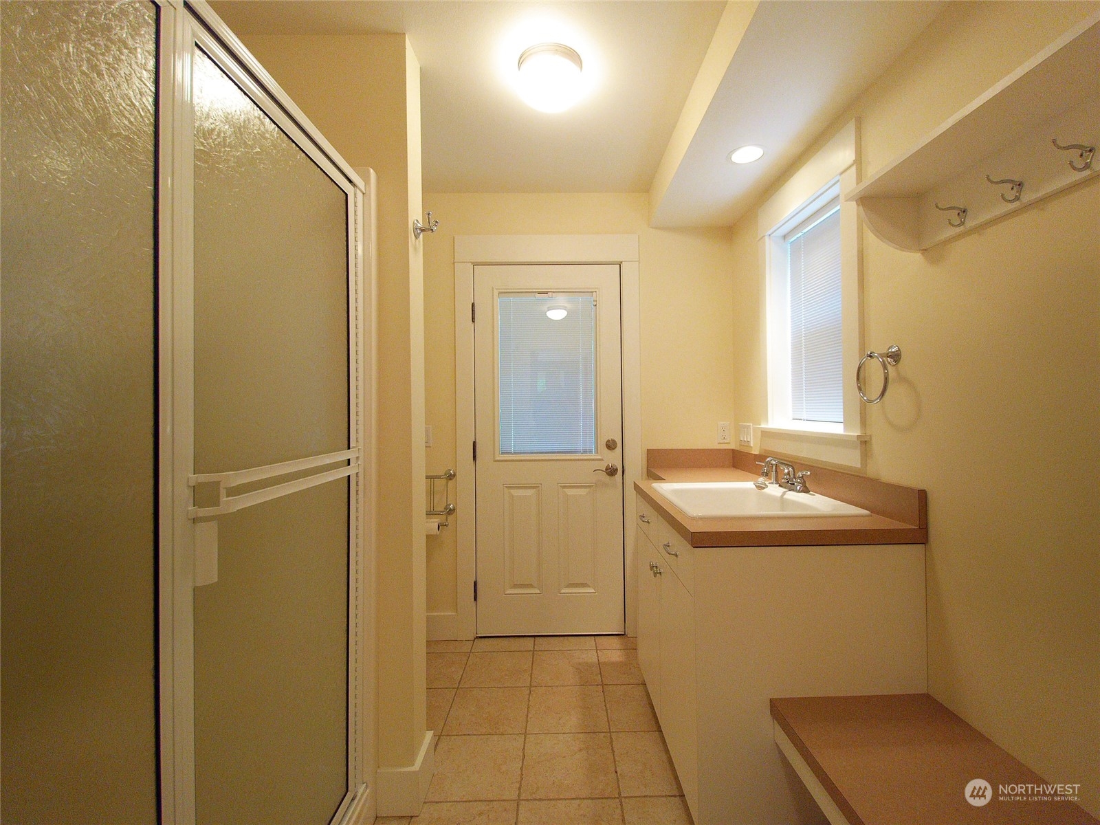 308 Lake Sutherland Road Port Angeles, WA 98363 - Photo 22 of 40 a bathroom with a sink and mirror with shower