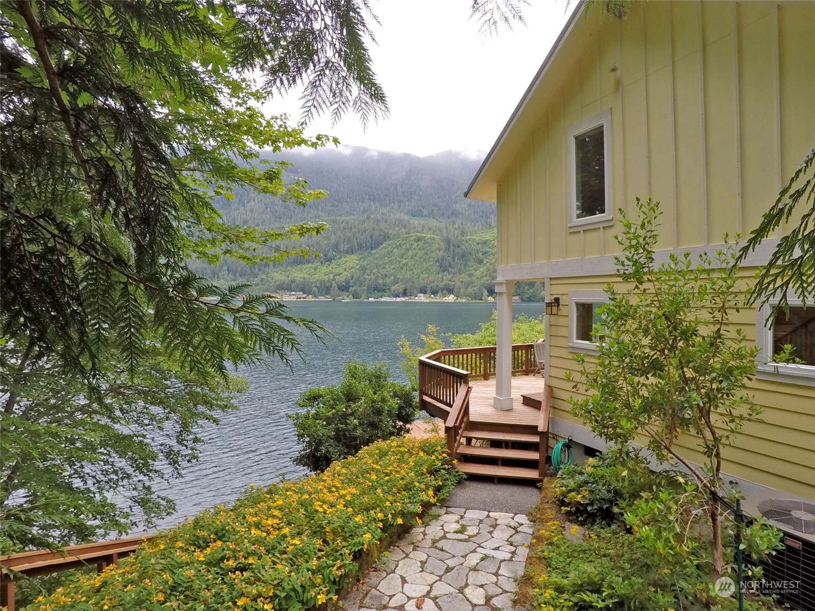 308 Lake Sutherland Road Port Angeles, WA 98363 - Photo 27 of 40 a view of a garden with lawn chairs
