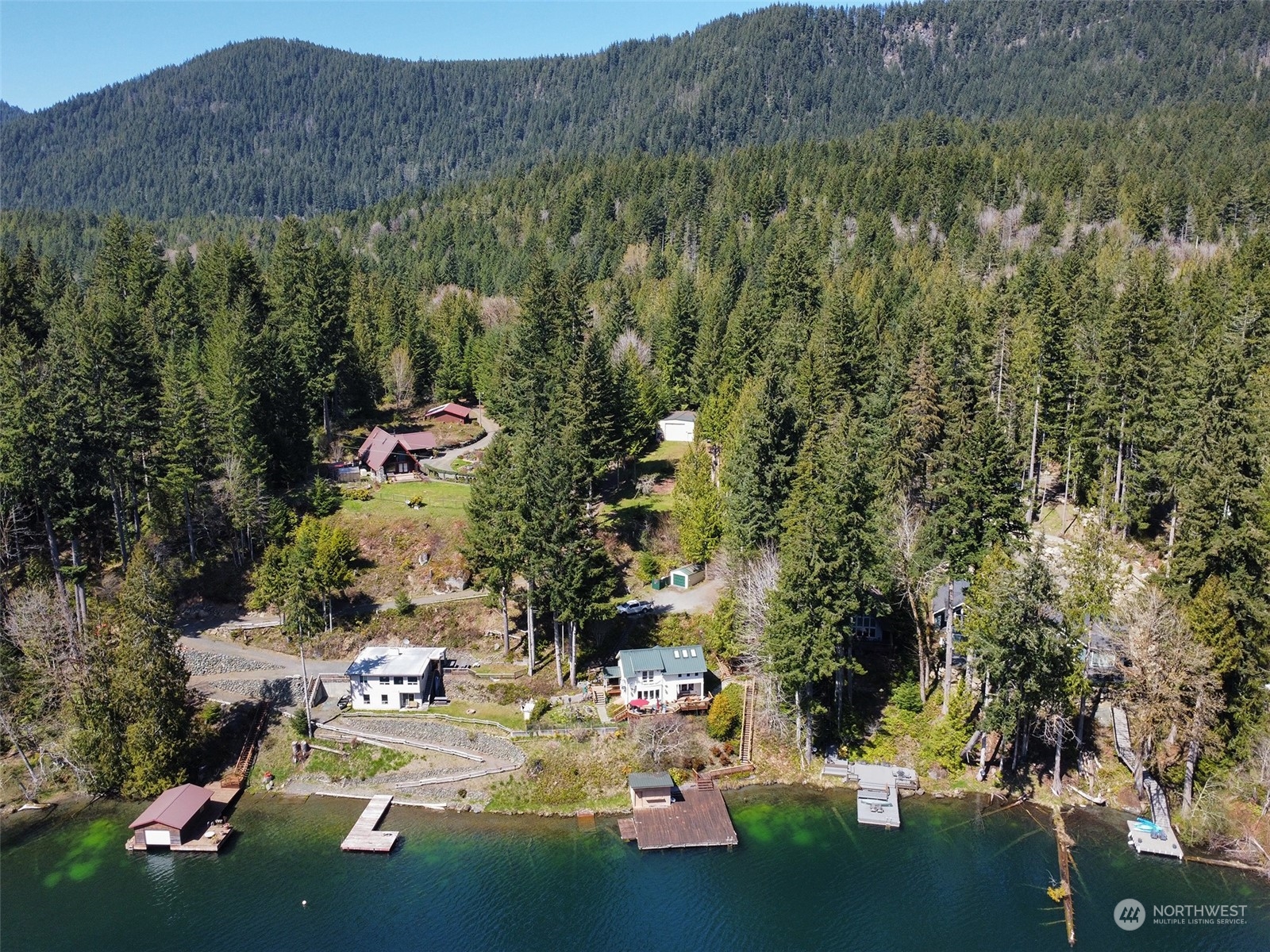 308 Lake Sutherland Road Port Angeles, WA 98363 - Photo 39 of 40 a view of a lake with a mountain