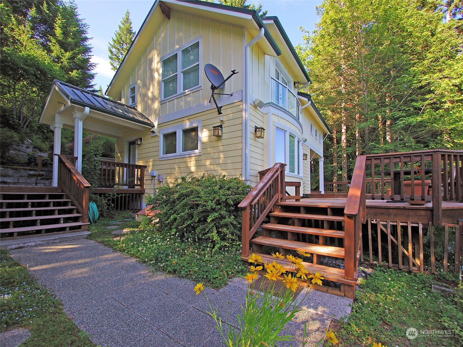 308 Lake Sutherland Road Port Angeles, WA 98363 - Photo 5 of 40 a front view of a house with a yard