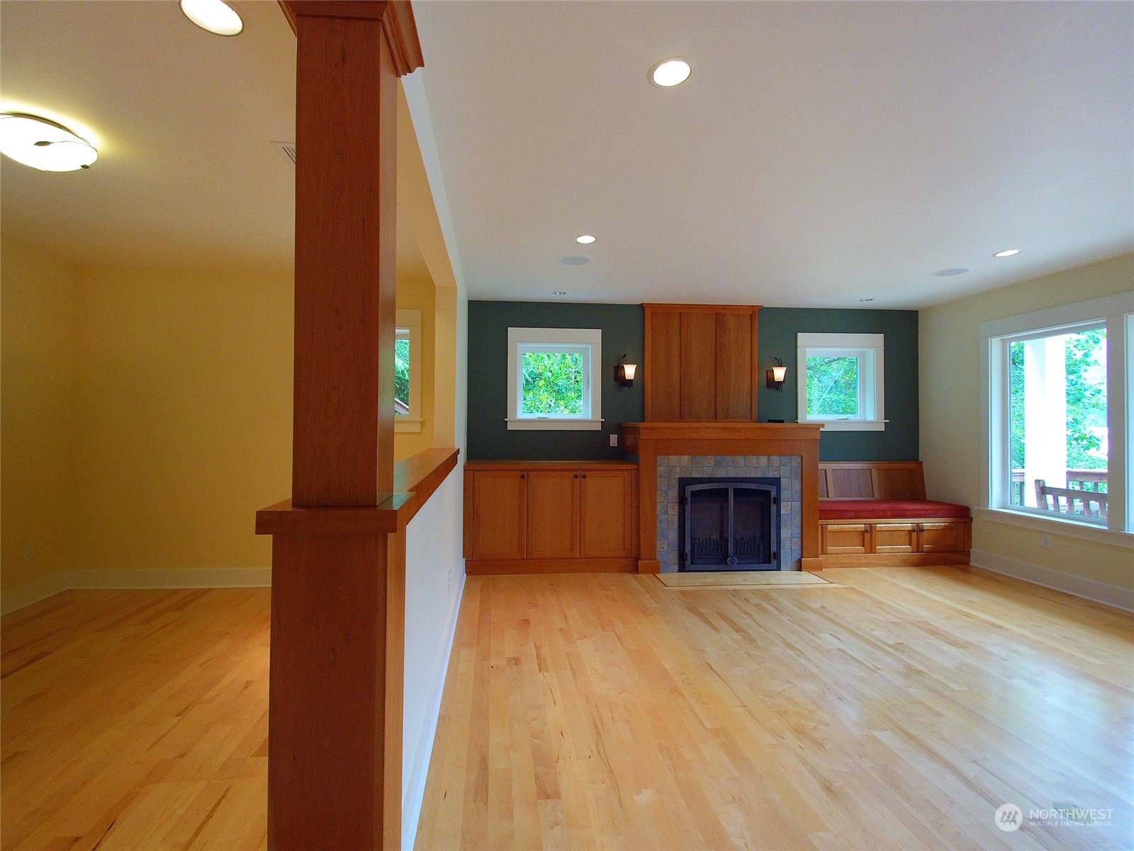 308 Lake Sutherland Road Port Angeles, WA 98363 - Photo 8 of 40 an empty room with windows and fireplace