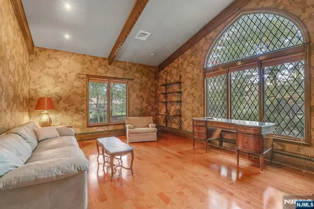 a living room with furniture and a large window
