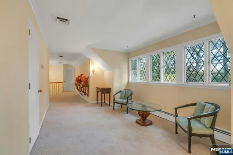 a view of a livingroom with furniture and a window