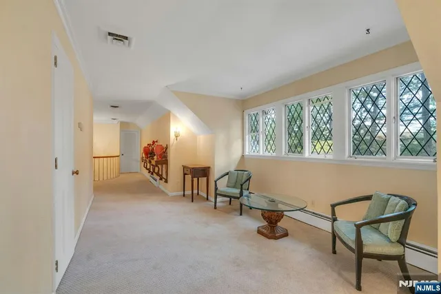 a view of a livingroom with furniture and a window
