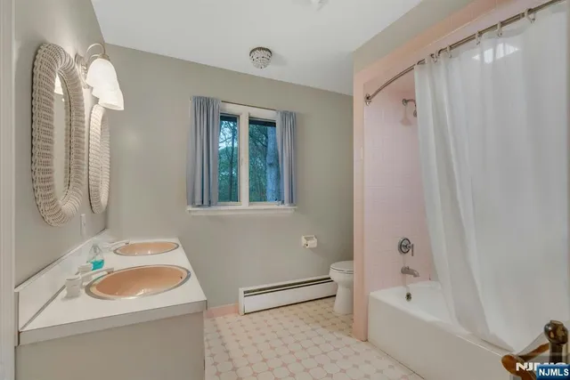 a bathroom with a sink a toilet and a bathtub