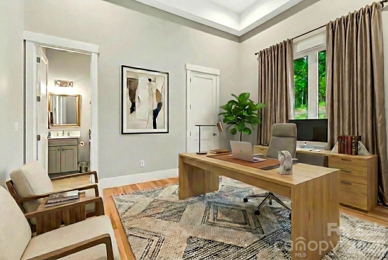 128 Saddle Ridge Drive Alexander, NC 28701 - Photo 12 of 33 a view of a workspace with furniture and a table