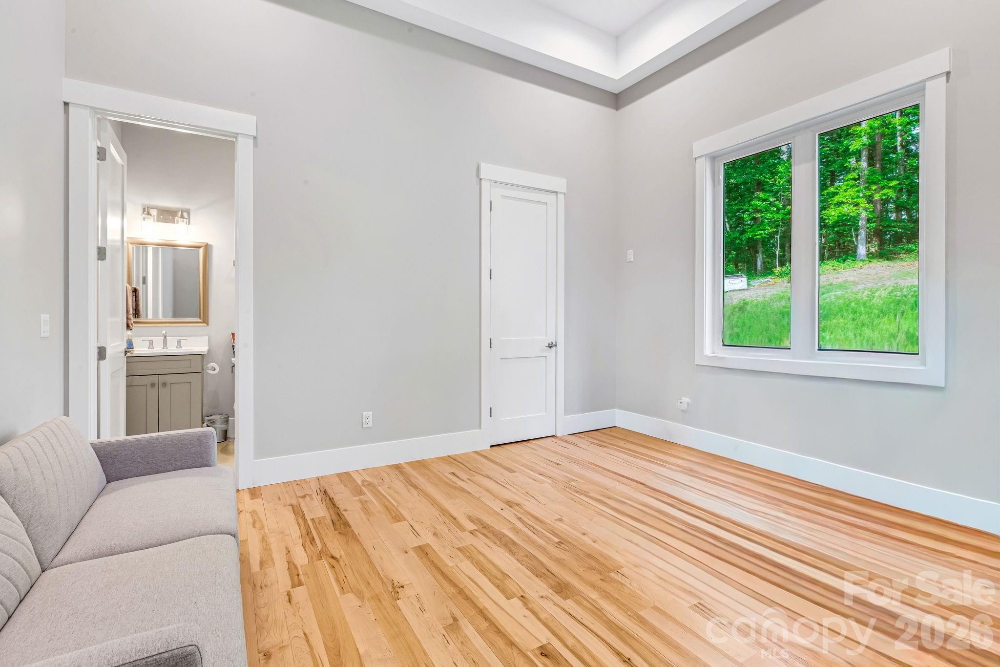 128 Saddle Ridge Drive Alexander, NC 28701 - Photo 13 of 33 a bedroom with a bed and a window