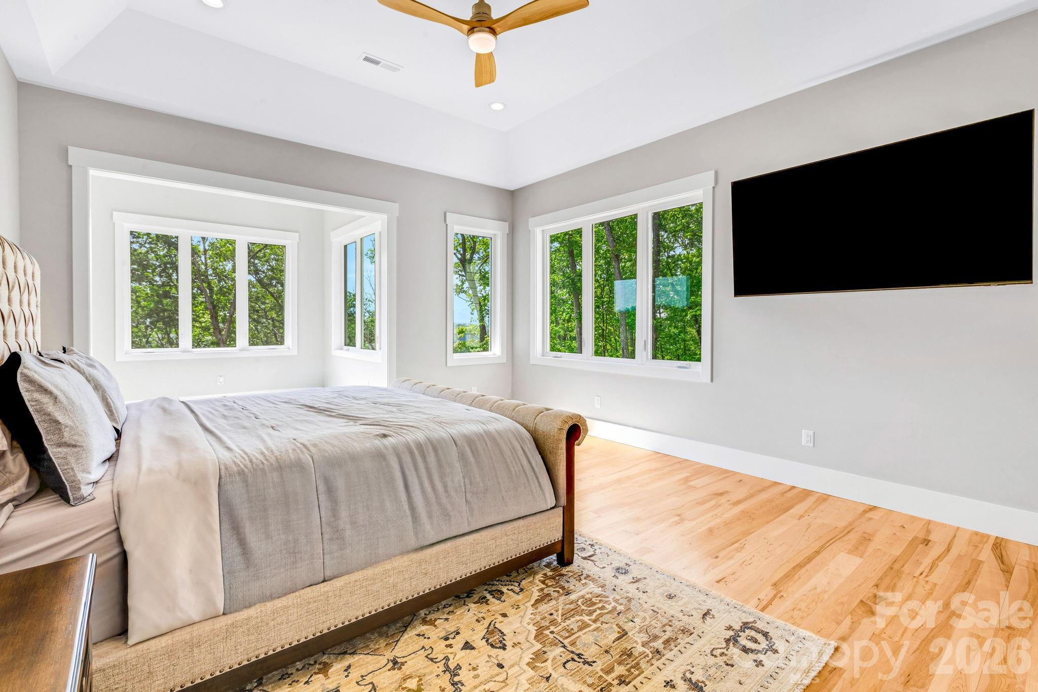 128 Saddle Ridge Drive Alexander, NC 28701 - Photo 15 of 33 a bed sitting in a bedroom next to a window