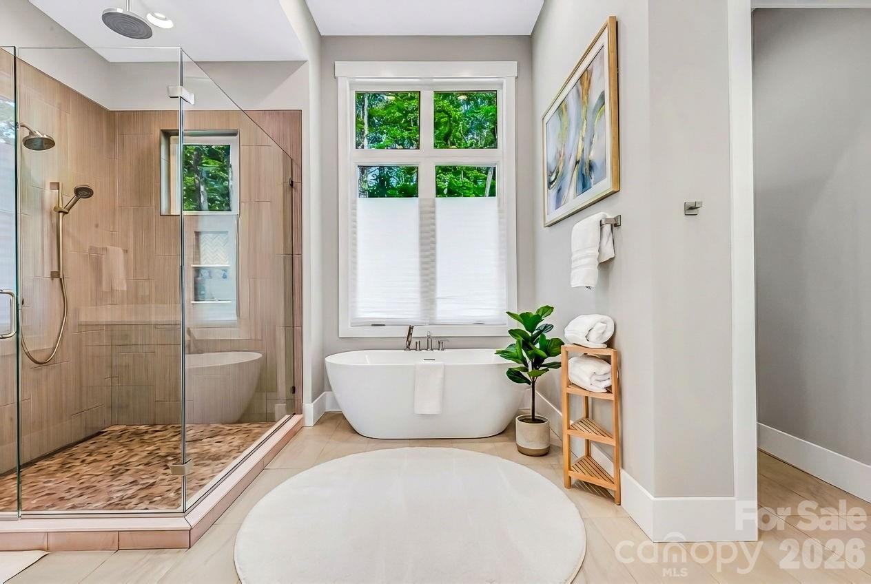 128 Saddle Ridge Drive Alexander, NC 28701 - Photo 17 of 33 a living room with furniture and a potted plant