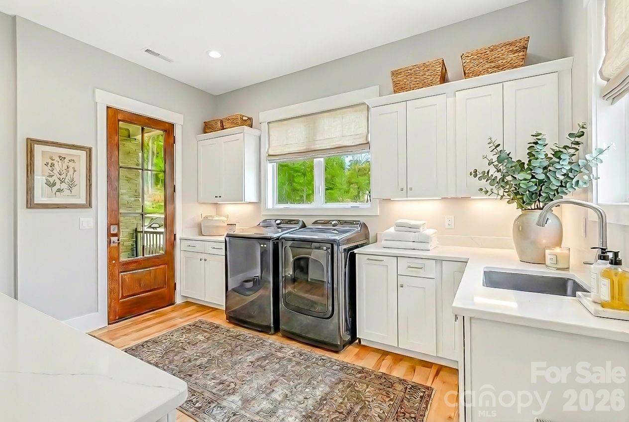 128 Saddle Ridge Drive Alexander, NC 28701 - Photo 19 of 33 a kitchen with stainless steel appliances granite countertop a stove a sink and a refrigerator