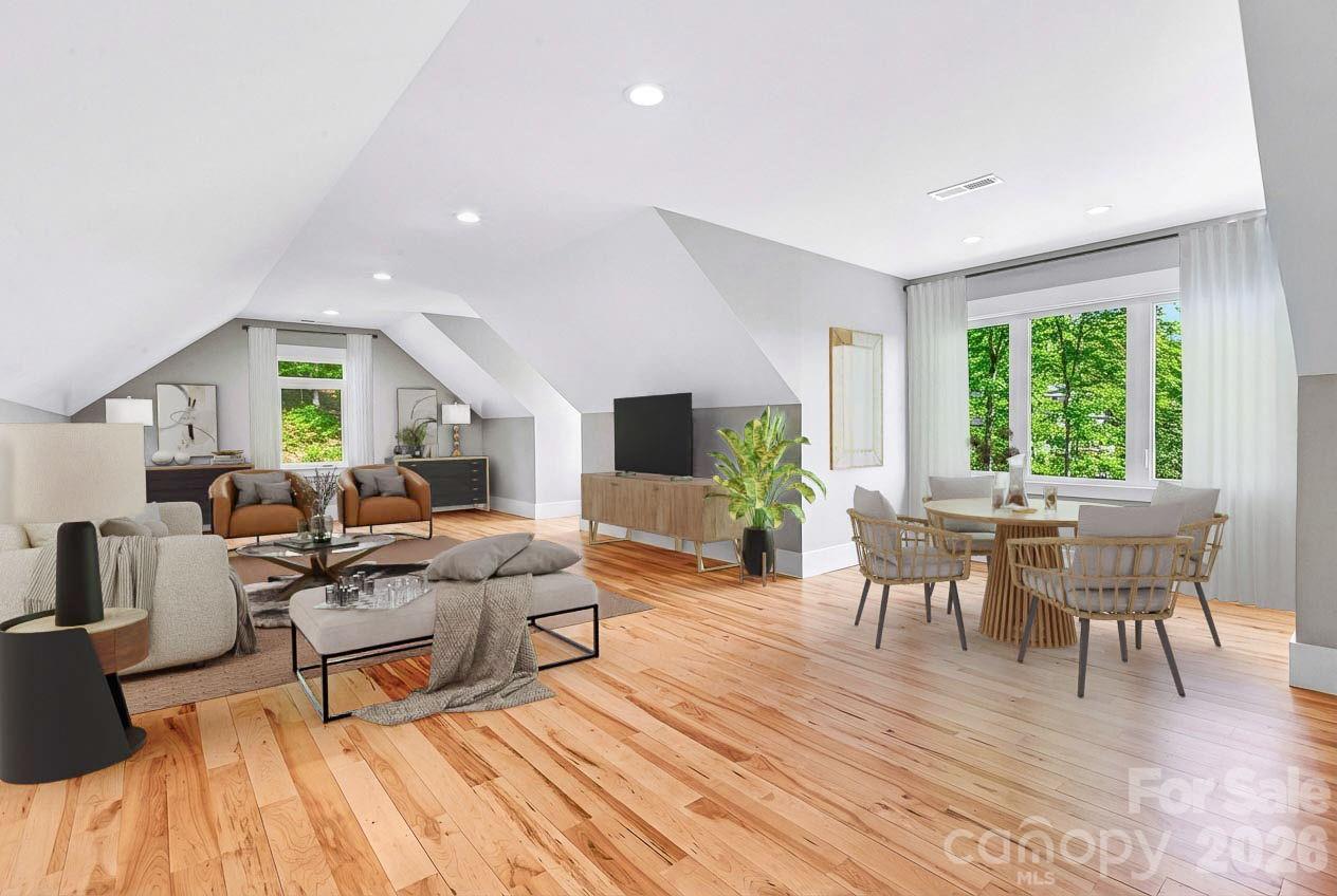 128 Saddle Ridge Drive Alexander, NC 28701 - Photo 21 of 33 a living room with furniture and a flat screen tv