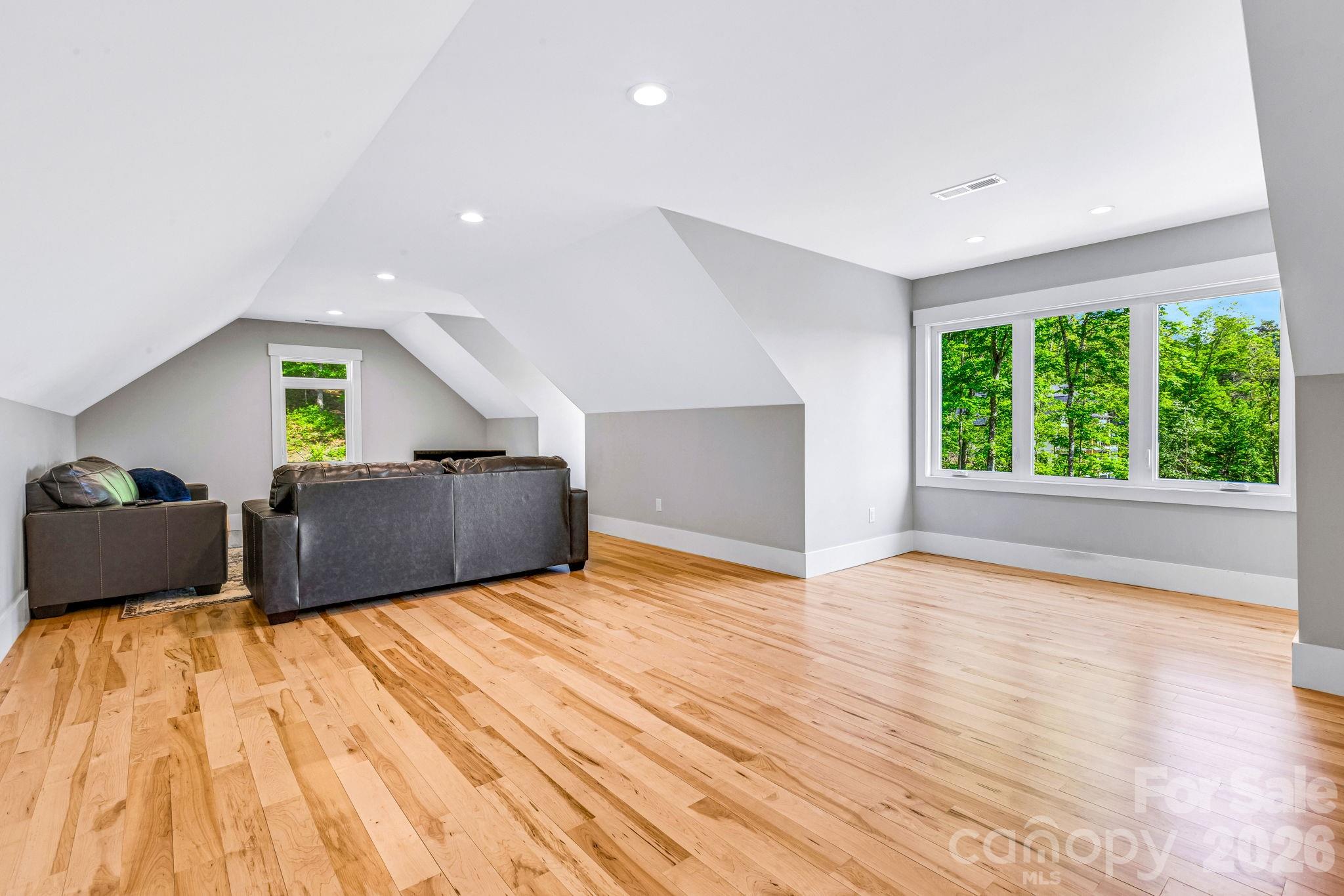 128 Saddle Ridge Drive Alexander, NC 28701 - Photo 22 of 33 a bedroom with a bed and a large window