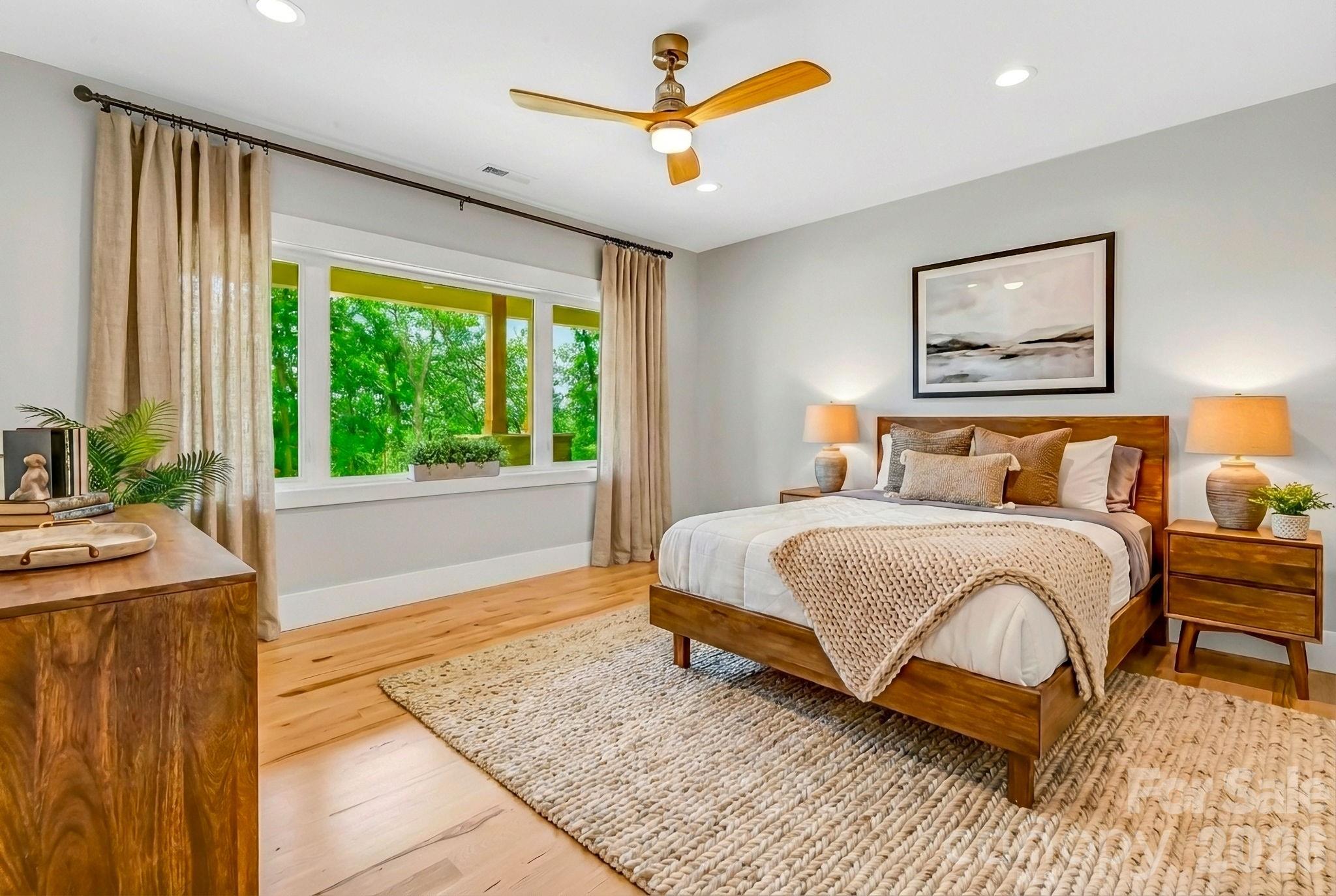 128 Saddle Ridge Drive Alexander, NC 28701 - Photo 25 of 33 a bedroom with a bed and a large window