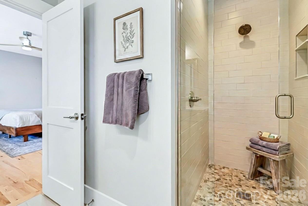 128 Saddle Ridge Drive Alexander, NC 28701 - Photo 27 of 33 a bathroom with a toilet and a shower