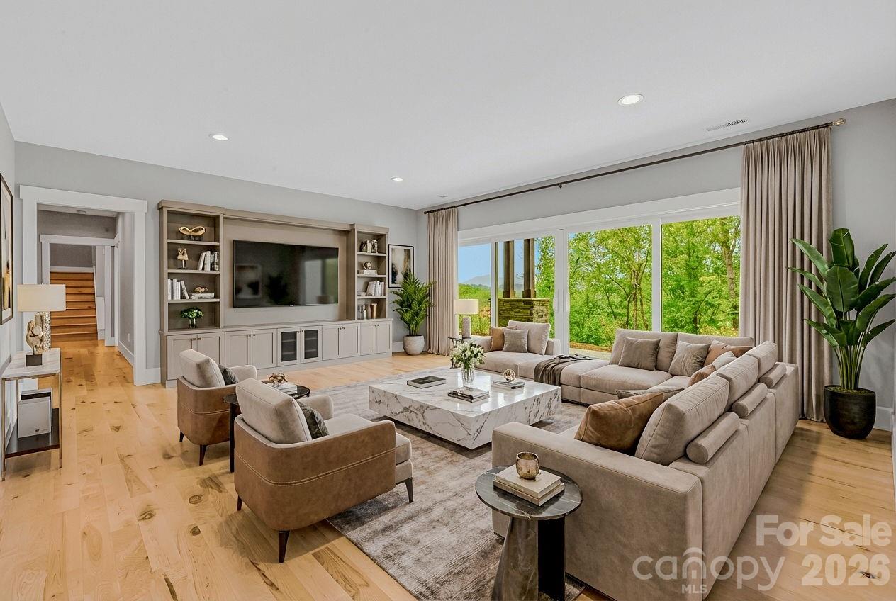 128 Saddle Ridge Drive Alexander, NC 28701 - Photo 29 of 33 a living room with furniture and a flat screen tv