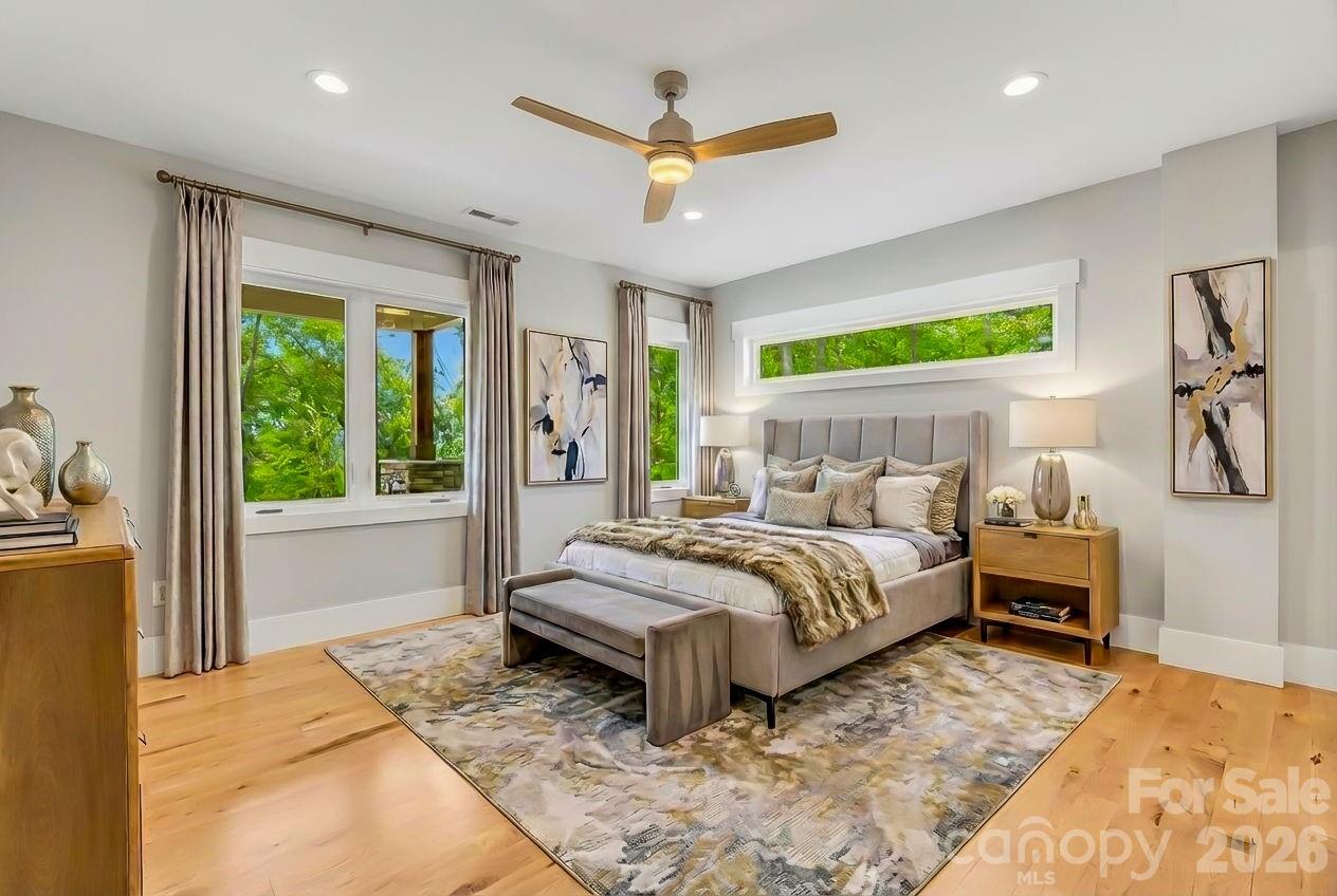 128 Saddle Ridge Drive Alexander, NC 28701 - Photo 31 of 33 a bedroom with a large bed and a large window