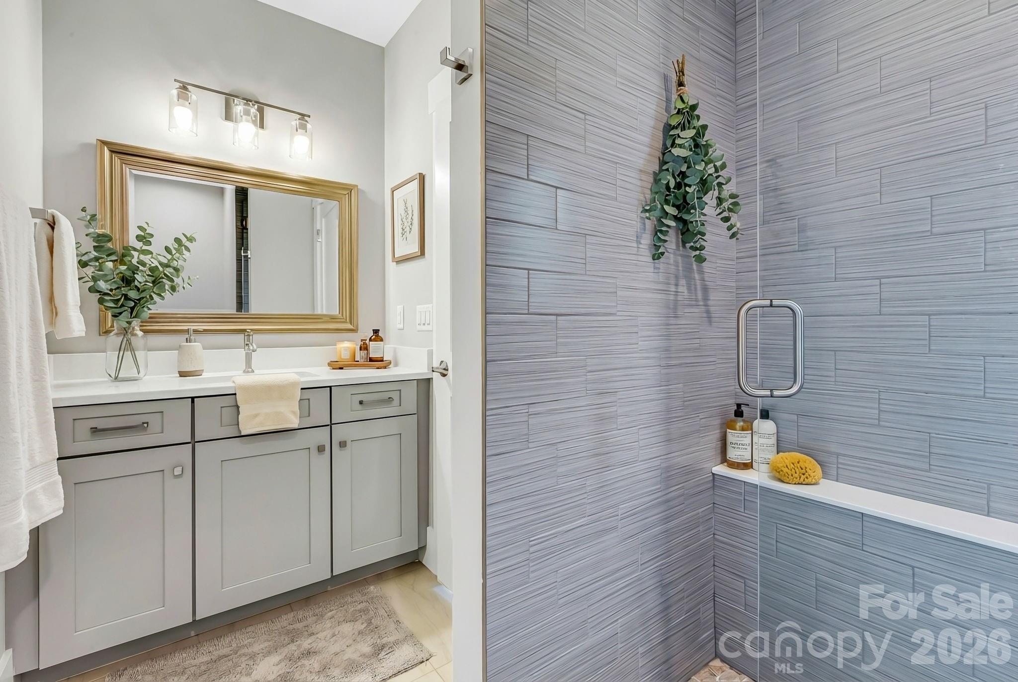 128 Saddle Ridge Drive Alexander, NC 28701 - Photo 32 of 33 a bathroom with a sink and a mirror