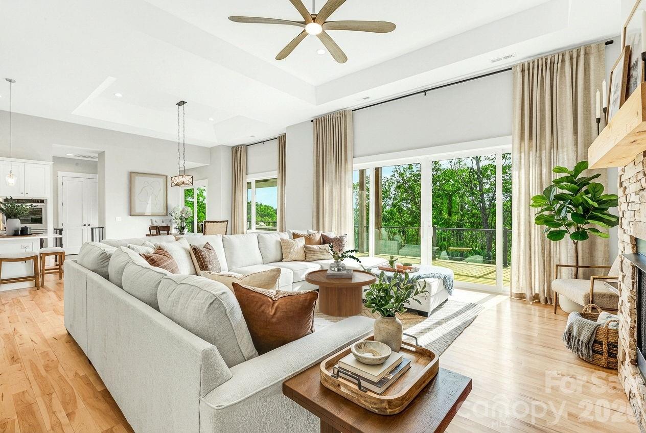 128 Saddle Ridge Drive Alexander, NC 28701 - Photo 5 of 33 a living room with furniture and a large window with garden view