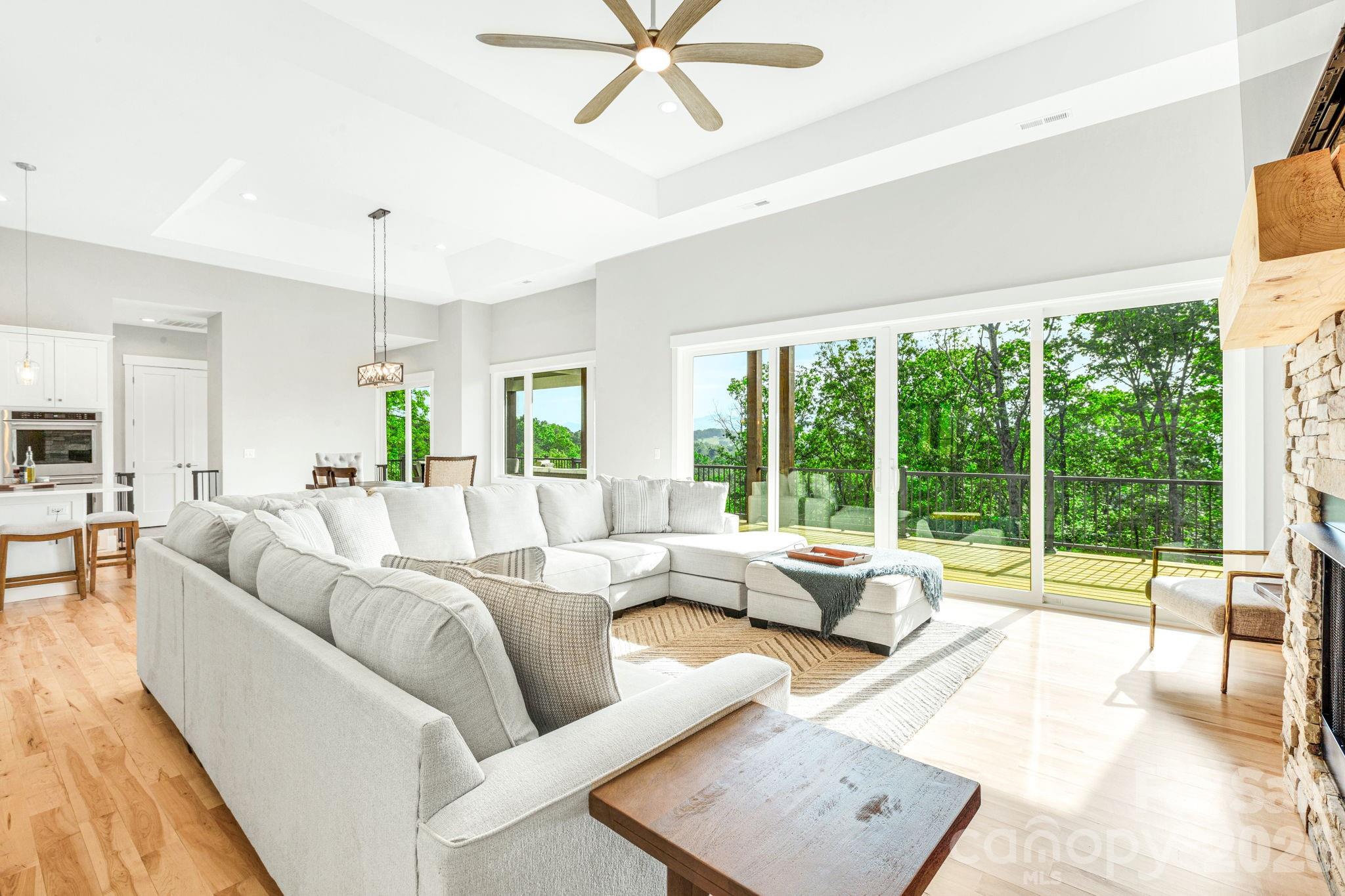 128 Saddle Ridge Drive Alexander, NC 28701 - Photo 6 of 33 a living room with furniture and a large window