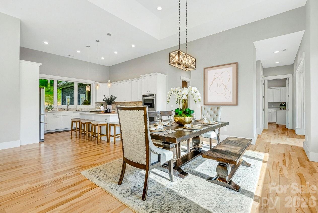 128 Saddle Ridge Drive Alexander, NC 28701 - Photo 9 of 33 a view of a dining room with furniture and chandelier