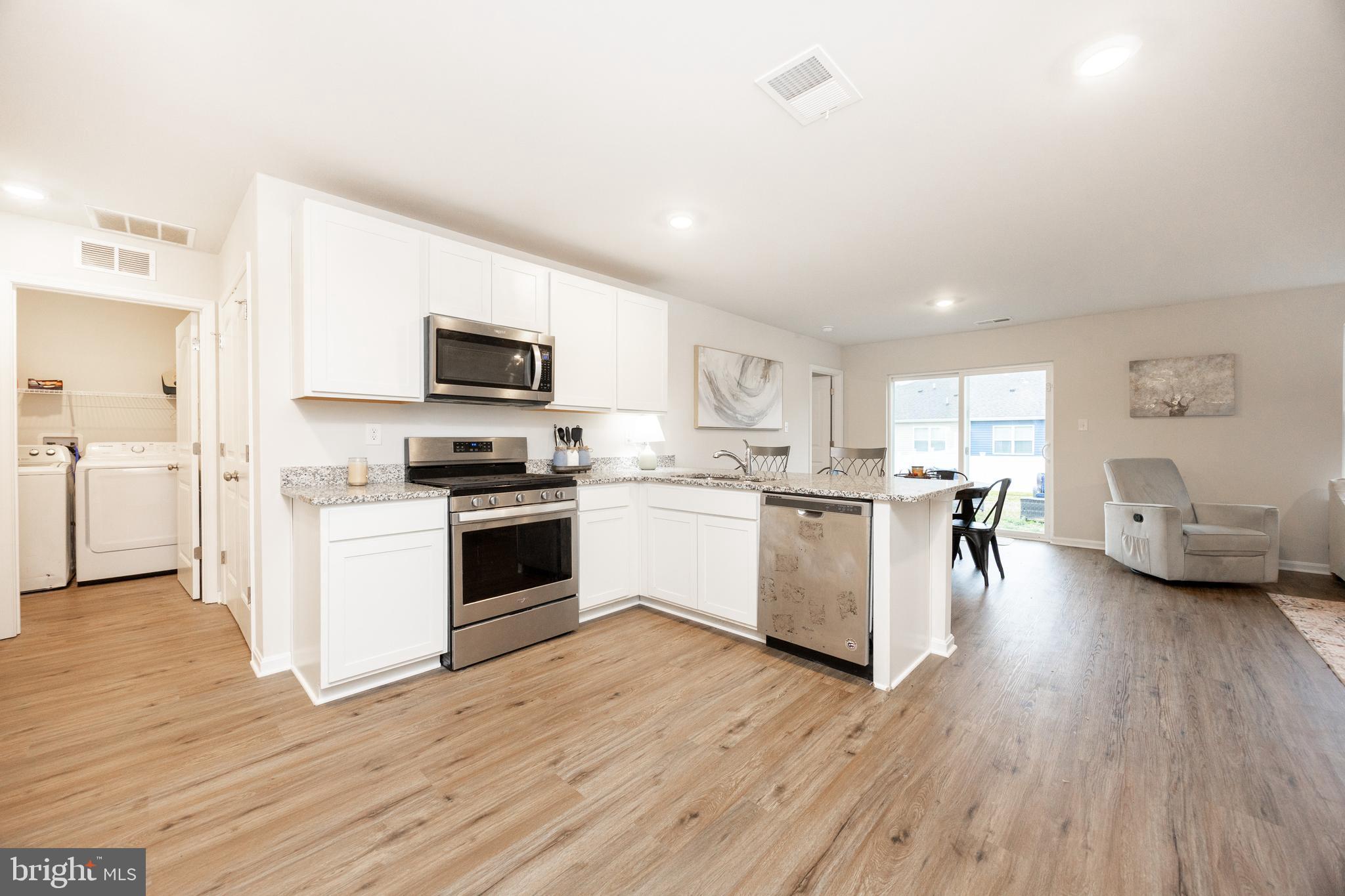 21 Clipper Street Smyrna, DE 19977 - Photo 11 of 39 a kitchen with a refrigerator and a stove top oven